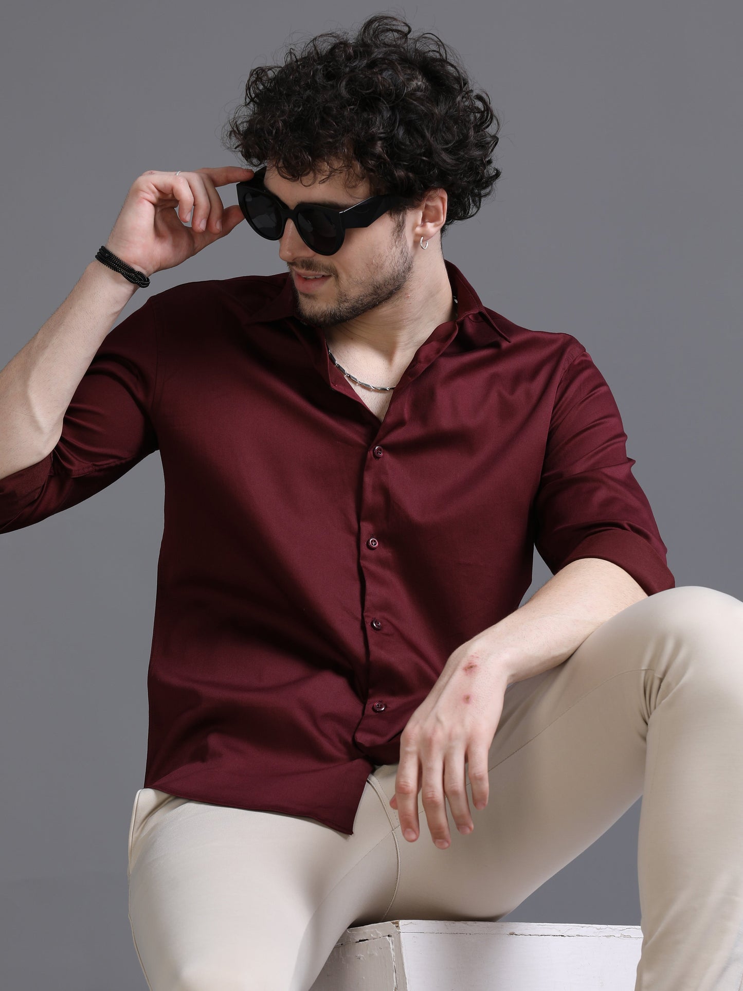 Burgundy colour shirt for men modeled by a stylish man posing with sunglasses