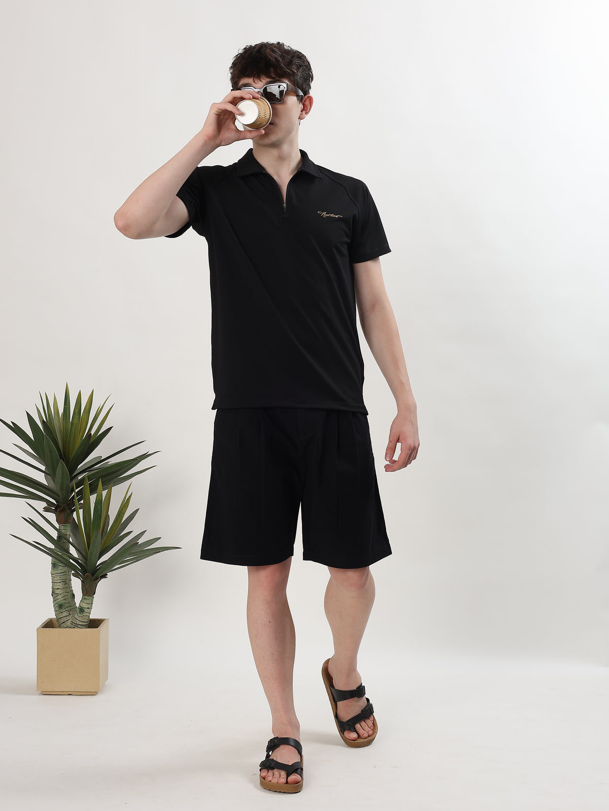 MEN BLACK TEXTURED HALF-ZIP POLO T-SHIRT
