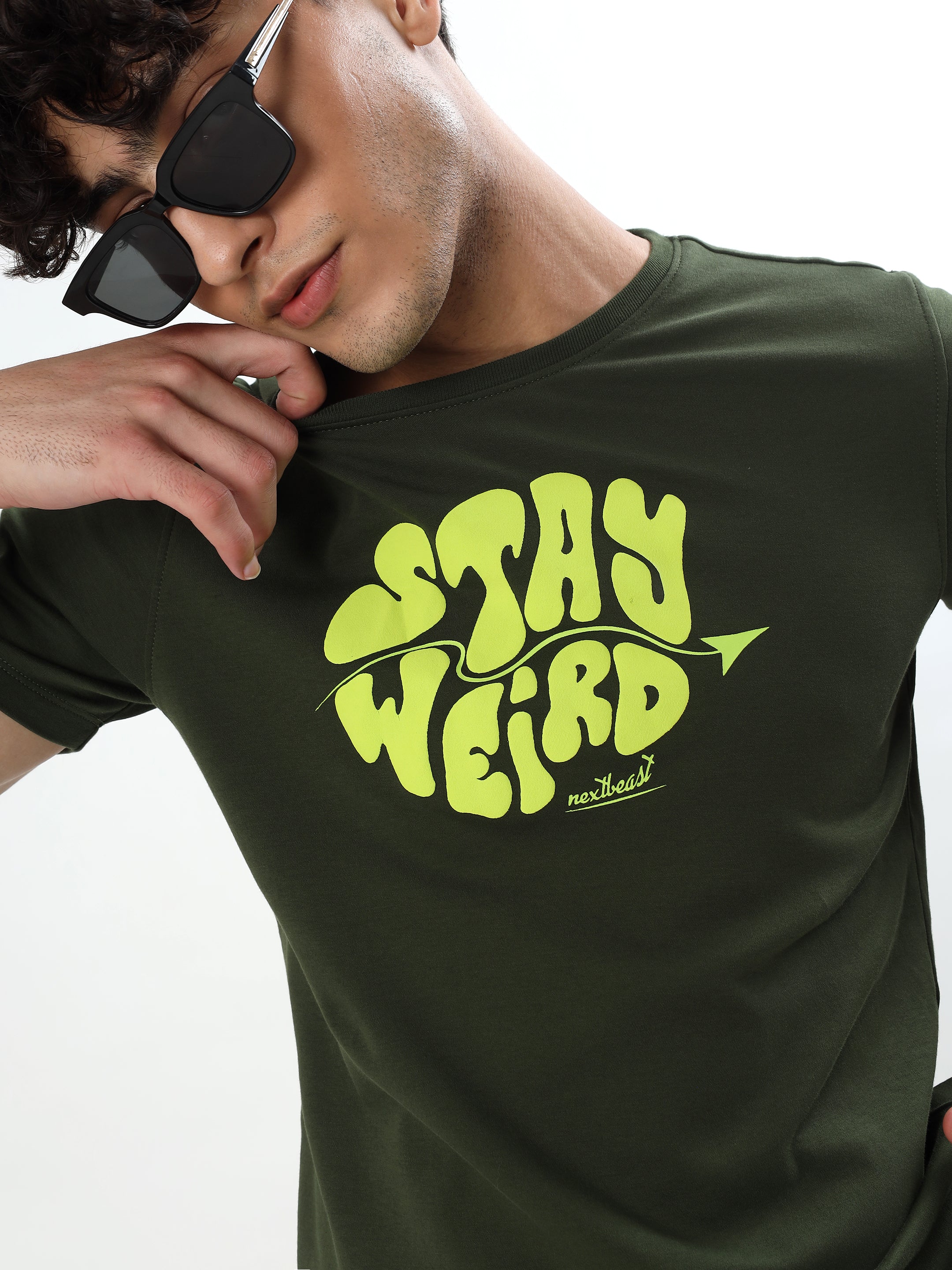 OLIVE GREEN STAY WEIRD TYPOGRAPHY GRAPHIC T-SHIRT